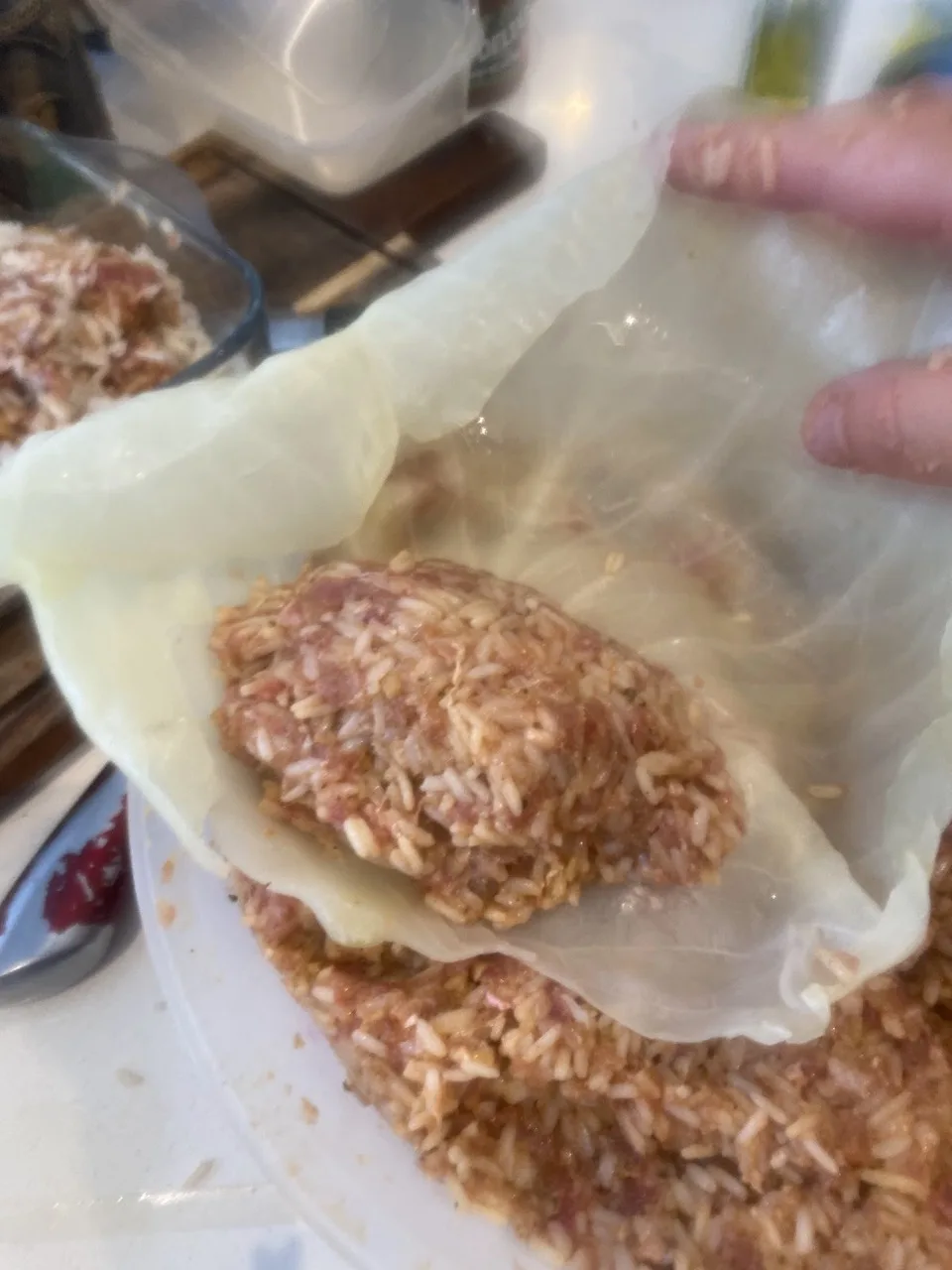 Rolling a leaf around the filling