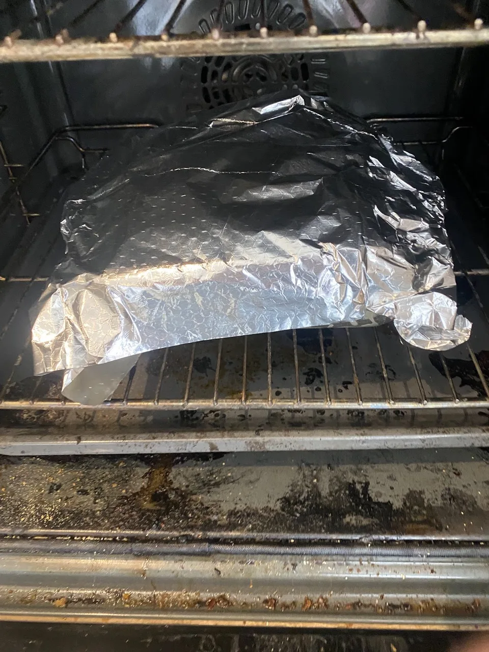 Under foil, in the oven